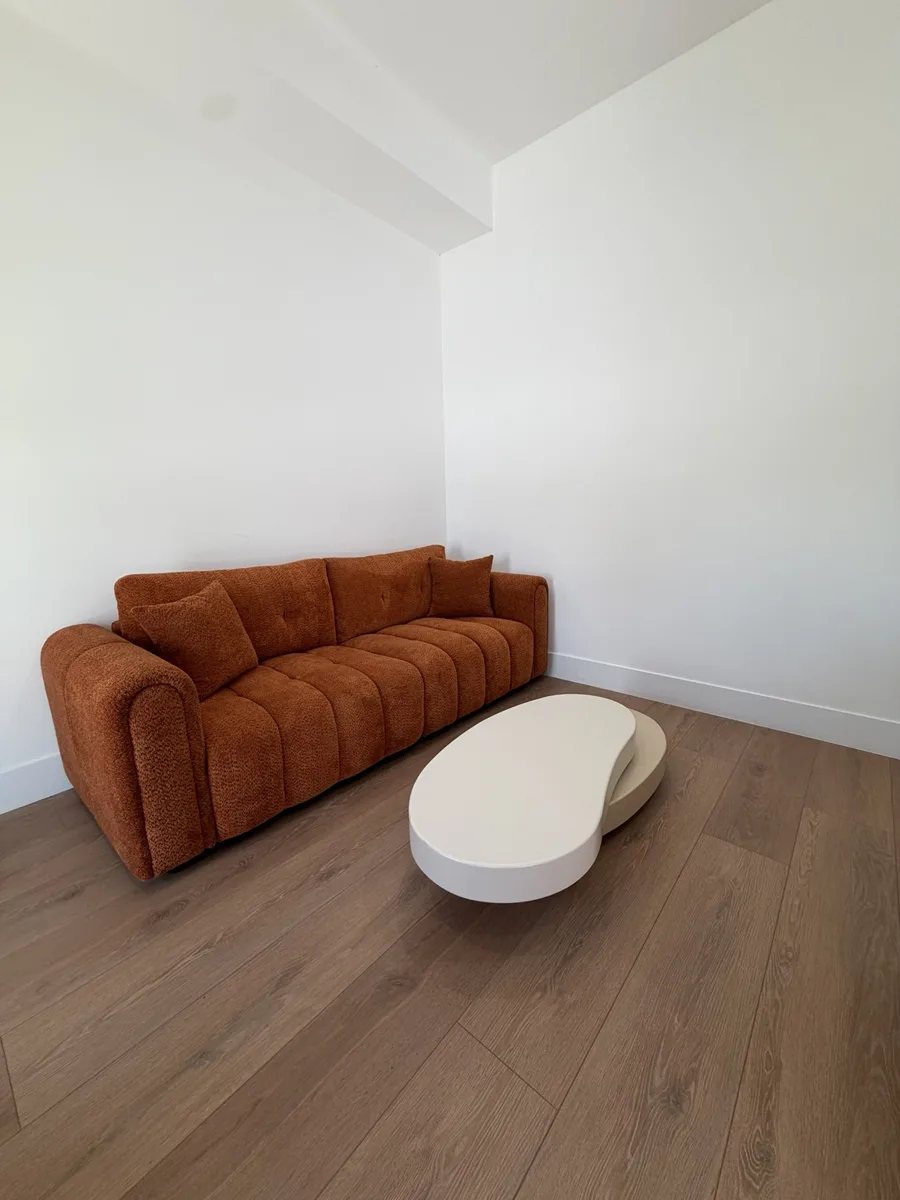Lumora Recovery lounge with orange furniture
